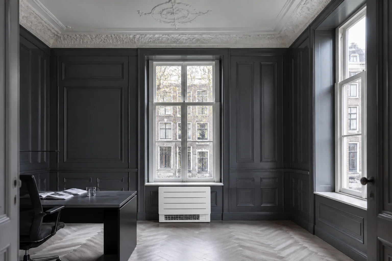 Floor-standing air conditioning unit in a listed office building with no work to the facade or ceiling